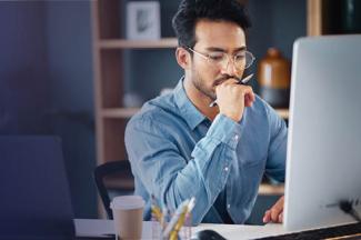 Man doing research on computer
